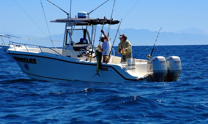 Fishing in Riviera Nayarit Mexico - image of man pulling in his catch