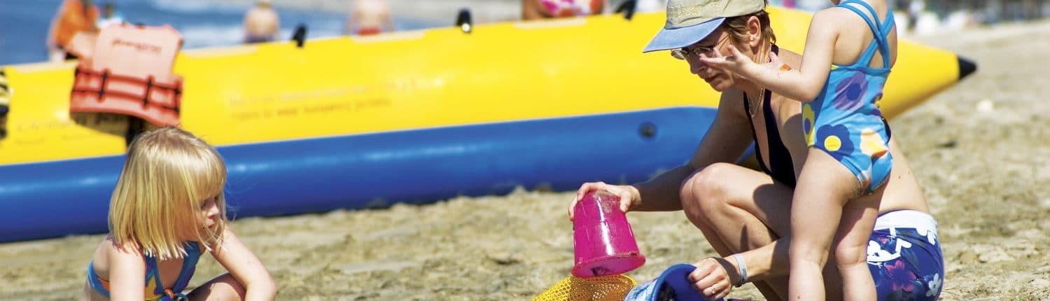 Schools in Riviera Nayarit Mexico - image of woman on beach with 2 children