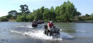 Group on ATVs cross a river in Riviera Nayarit MX