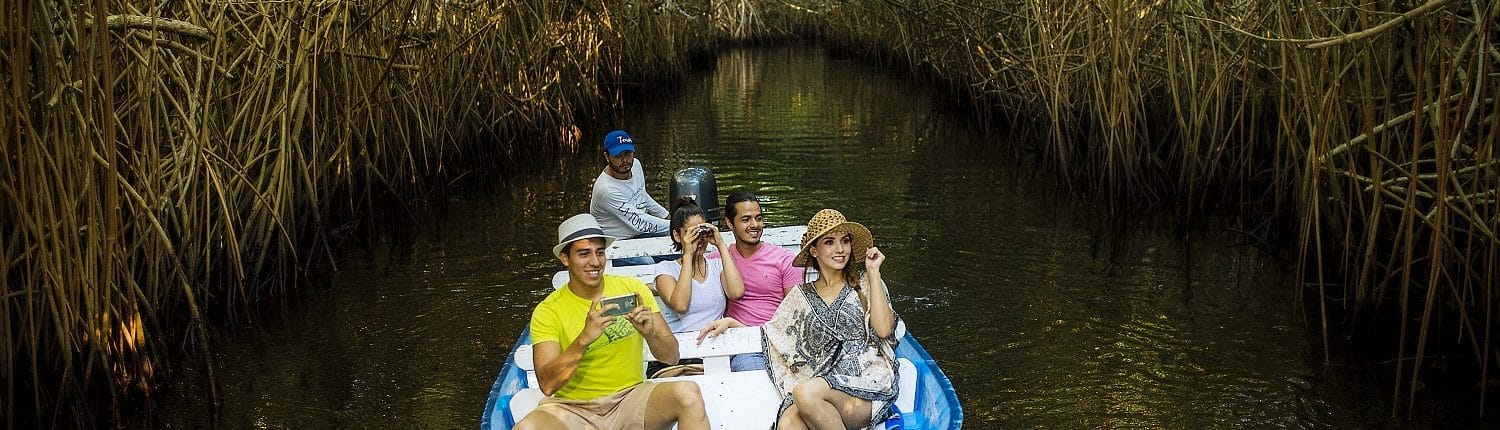 Birdwatching in Riviera Nayarit Mexico - image of 2 couples in a boat birdwatching