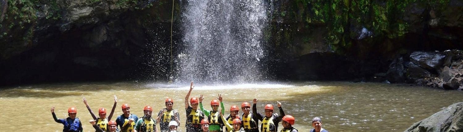 Rappelling group in pool below waterfalls in Riviera Nayarit Mexico