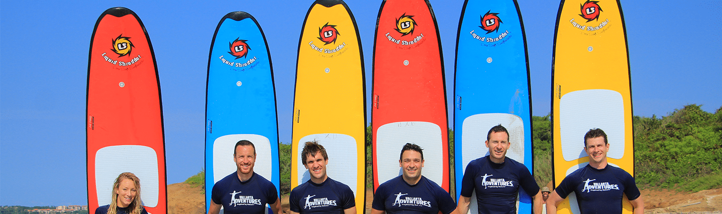 paddle-board-lessons Six instructors with their paddle boards in Riviera Nayarit